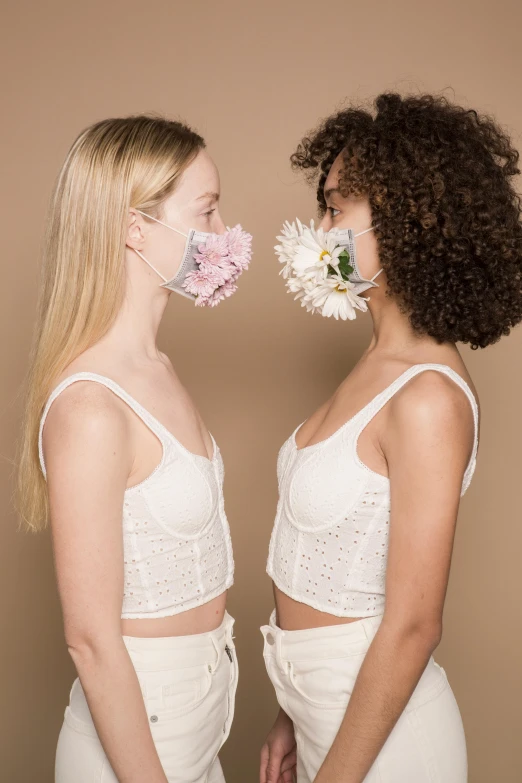 two women standing next to each other with flowers in their mouths, inspired by Vanessa Beecroft, trending on pexels, renaissance, white bra, wearing facemask, wearing crop top, gushy gills and blush