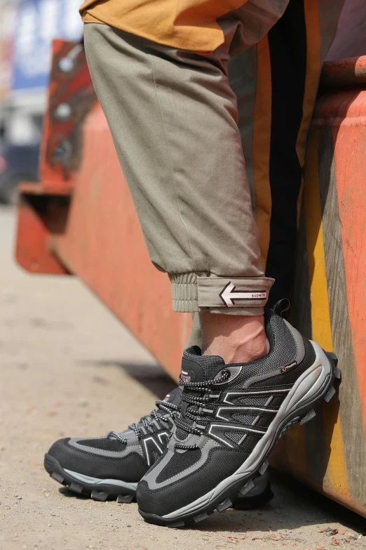 a person standing on the side of a bus, by Joe Stefanelli, wearing two silver bracelets, wearing cargo pants, running shoes, worksafe. dramatic