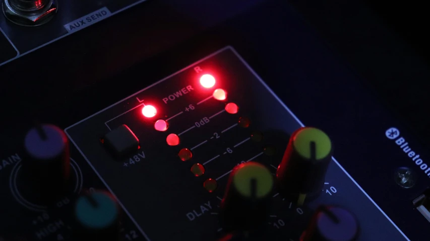 a close up of a control board with red lights, an album cover, vollumetric lighting, led indicator, multi - coloured, dark