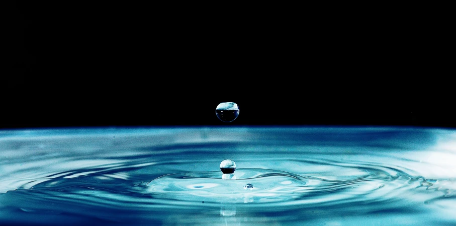 a drop of water falling into a pool of water, by Jan Rustem, pixabay, renaissance, objects that float, blue marble, black water, realistic water sharp focus