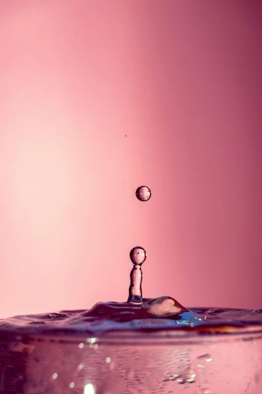 a water drop falls into a glass of water, an album cover, inspired by Lucio Fontana, trending on pexels, minimalism, smooth pink skin, bubblegum, sculpture made of water, hydration