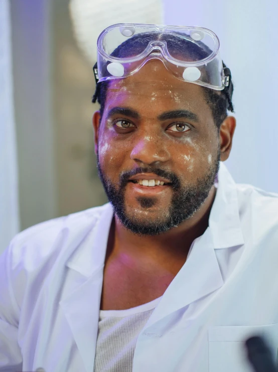 a man in a lab coat and goggles, inspired by Dr. Atl, trending on reddit, amazing beauty, wet face, color corrected, ismail