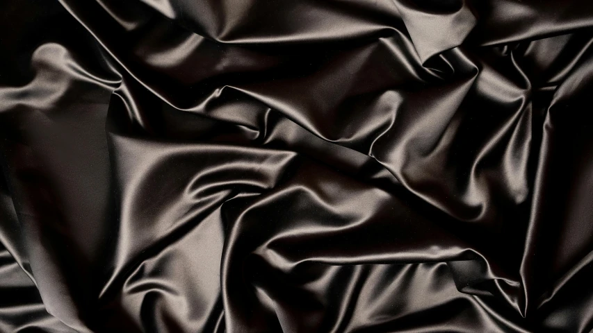 a close up of a black satin fabric, dark brown hair, smooth light shading, folds, detailed product image