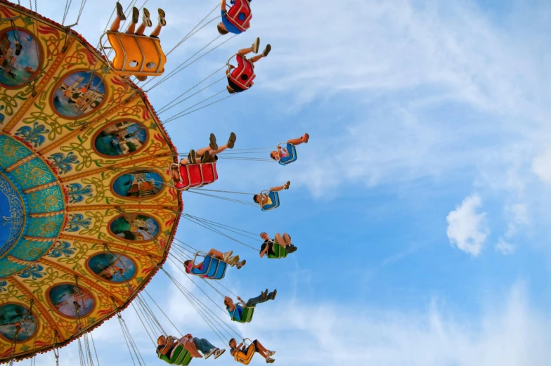 a group of people riding on top of a carousel, pexels contest winner, flying into the sky, avatar image, adventure playground accident, profile image