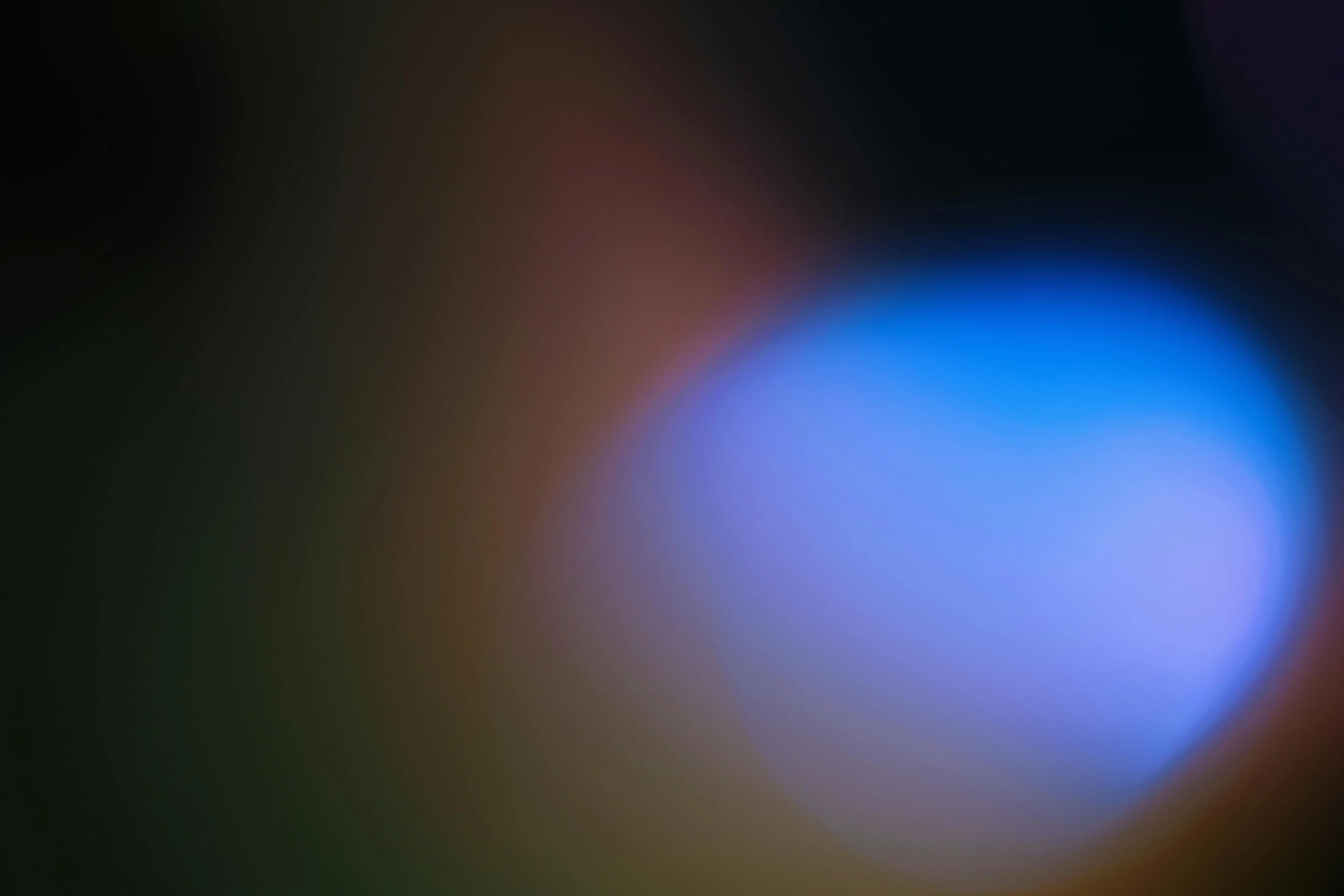 a close up of a cell phone with a blurry background, by Jan Rustem, light and space, orange to blue gradient, f / 1. 9 6. 8 1 mm iso 4 0, volumetric light fog, iridiscent rim light