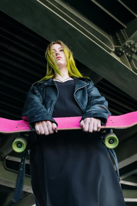 a woman in a black dress holding a pink skateboard, by Julia Pishtar, trending on pexels, renaissance, long green hair, wearing a black hoodie, wheels, ramps