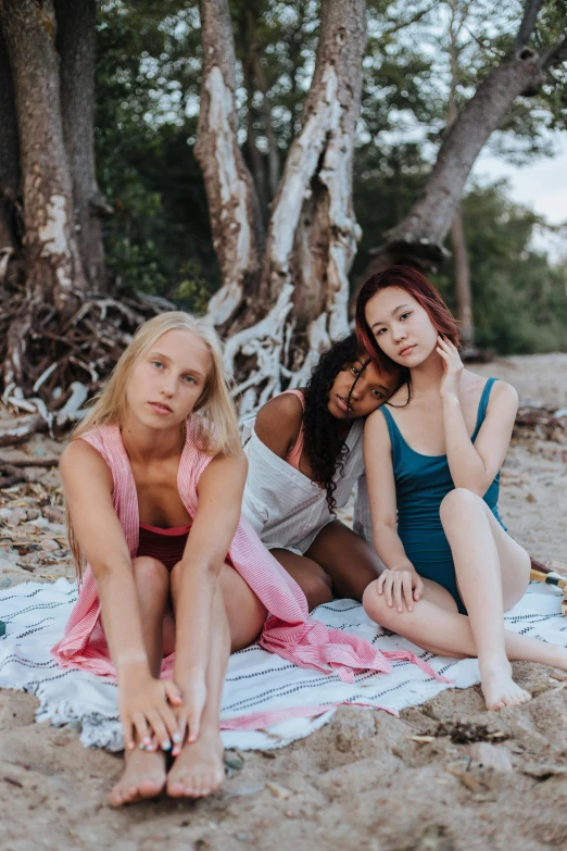a group of women sitting on top of a beach, sydney sweeney, ruan jia and mandy jurgens, pink and blue colour, warm skin tone