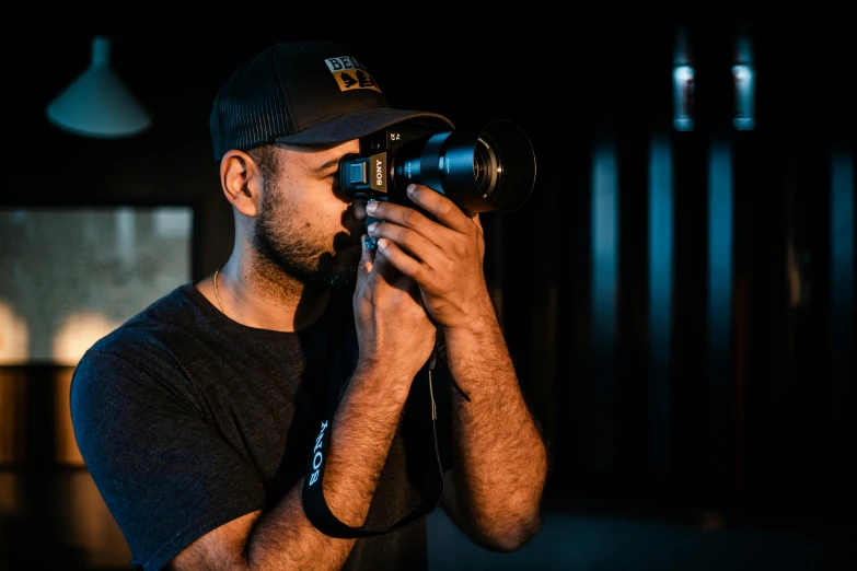 a man taking a picture with a camera, by Robbie Trevino, ray cinematic, indoor picture, kyza saleem, shot from the side