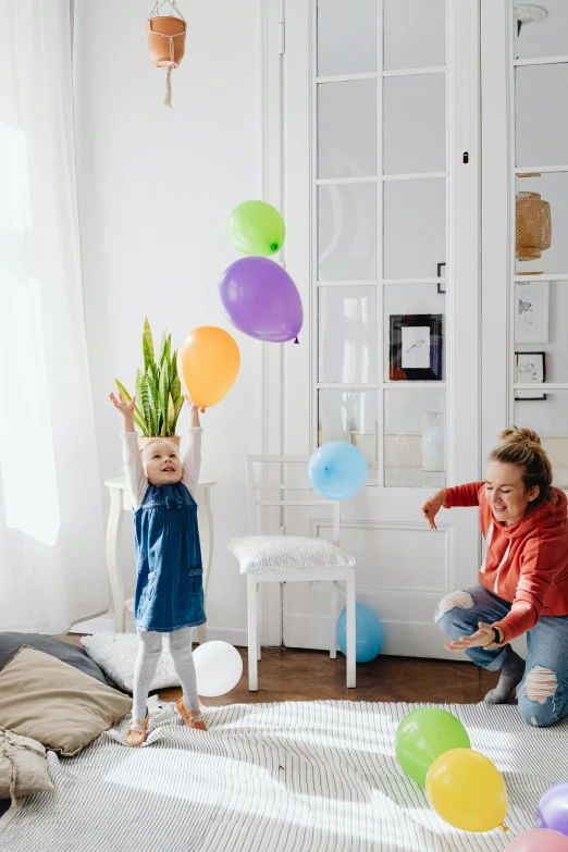 a woman and a child playing with balloons, inspired by The Family Circus, bright room, connectivity, jumping, toddler