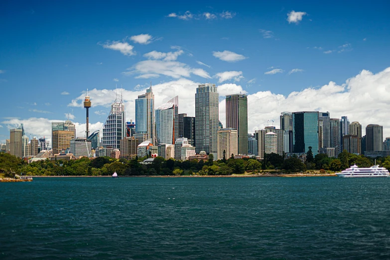 a large body of water with a city in the background, inspired by Sydney Carline, pexels contest winner, hurufiyya, gigapixel photo, fan favorite, 2000s photo, clear and sunny