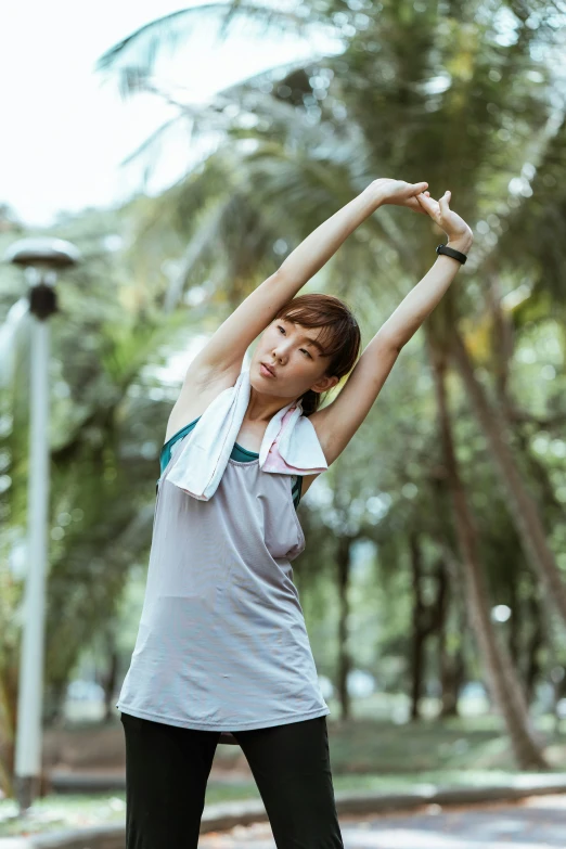 a woman stretching her arms in a park, happening, ren heng, square, active, 4l