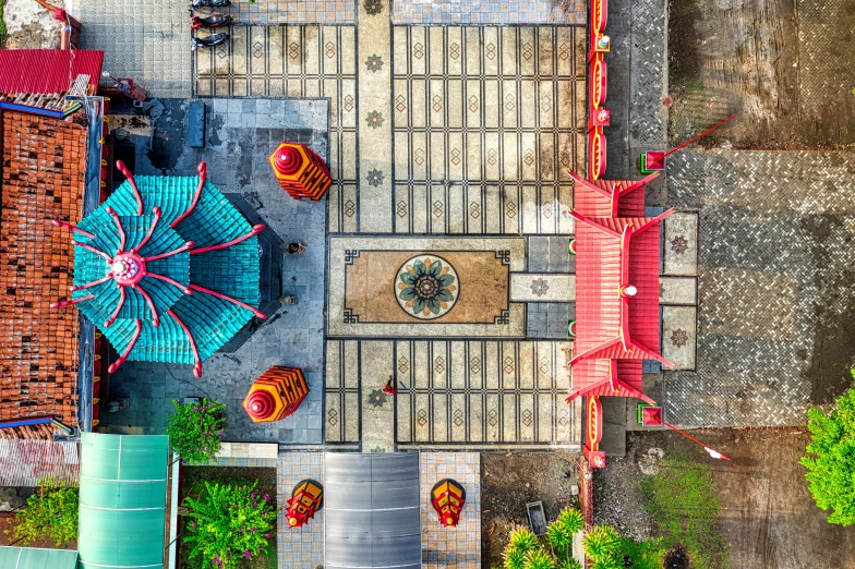 an aerial view of a building with a red roof, pexels contest winner, cloisonnism, floating chinese lampoons, square, colored photo, image