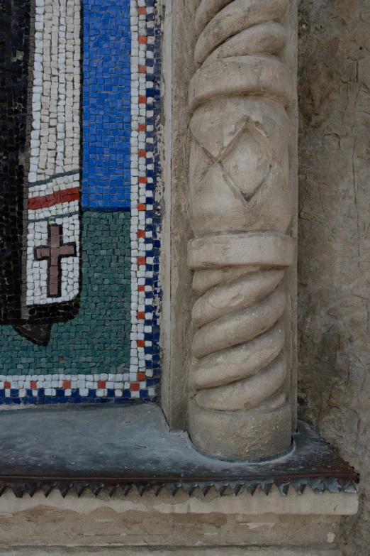 a close up of a window in a building, a mosaic, inspired by Taddeo Gaddi, reddit, romanesque, stone pillars, 8k detail, holy cross, shoreline