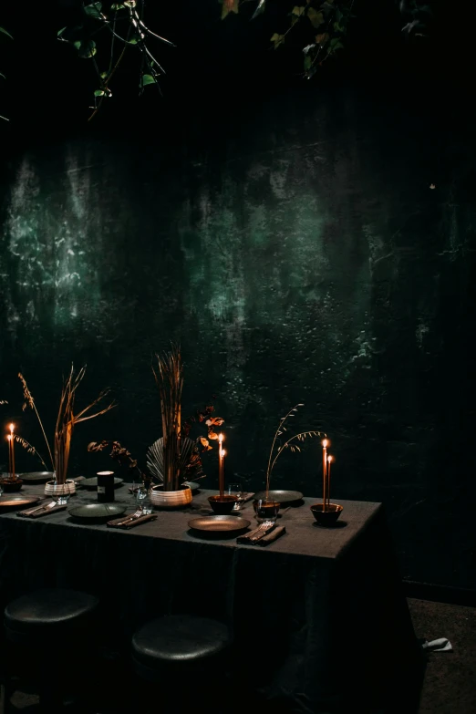 a table that has a bunch of candles on it, by Elsa Bleda, vantablack wall, fine dining, autumnal, rain lit