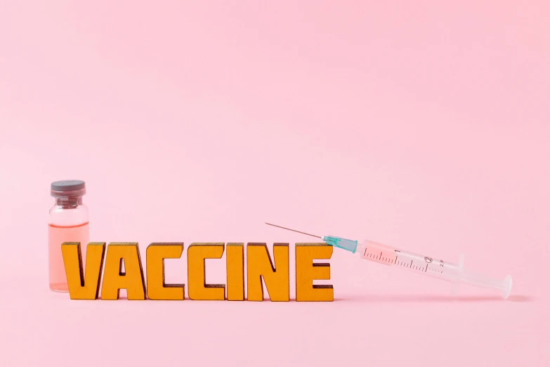 a syll next to the word vaccine on a pink background, background image, clemens ascher, mixed art, medical machinery