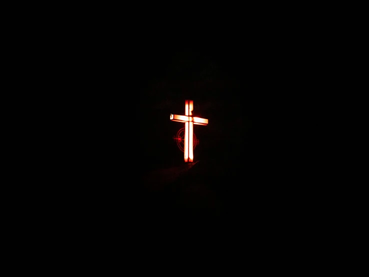 a cross lit up in the dark, an album cover, by Attila Meszlenyi, unsplash, hurufiyya, red neon, 👰 🏇 ❌ 🍃, christian, phosphorescent