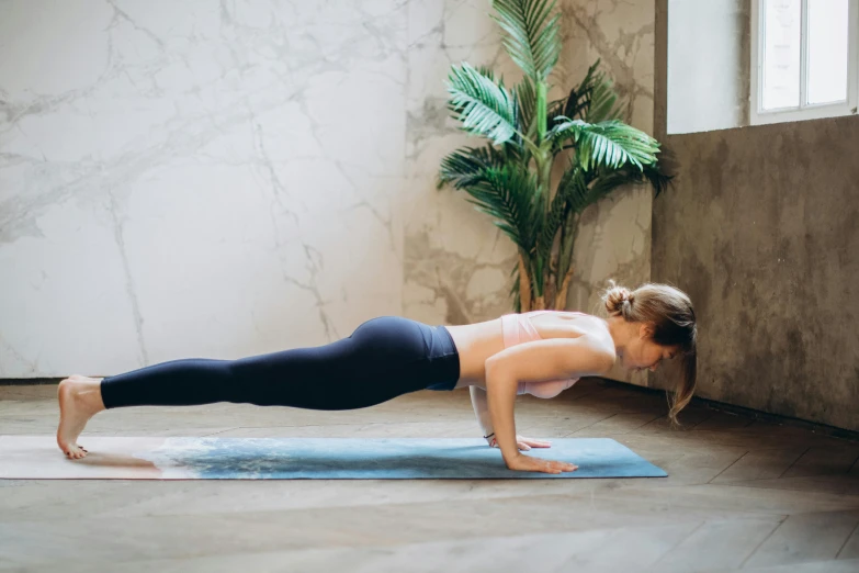 a woman doing a yoga pose on a yoga mat, pexels contest winner, 🦩🪐🐞👩🏻🦳, manuka, profile image, sculduggery