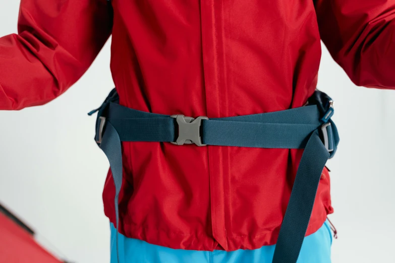 a person wearing a red jacket and blue pants, figuration libre, body harness, zoomed out view, detailed product image, wide belt