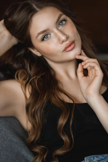 a beautiful young woman sitting on top of a couch, a portrait, trending on pexels, renaissance, light brown hair blue eyes, featured face details, 🤤 girl portrait, perfect lips