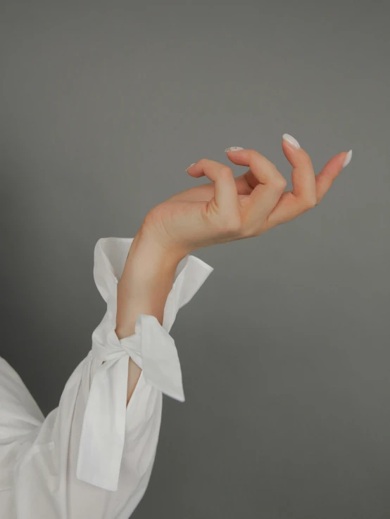 a close up of a person wearing a white shirt, aestheticism, long fingernails, profile image, ansel ], thick bow