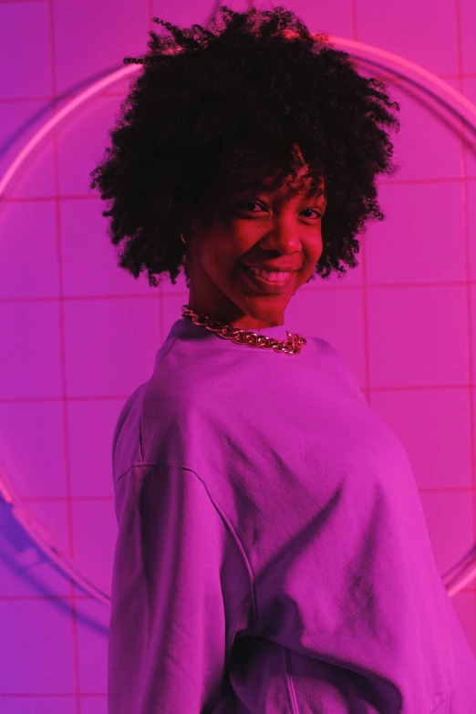 a woman standing in front of a neon circle, afrofuturism, dark short curly hair smiling, ((purple)), vaporwave mall aesthetic, high quality photo