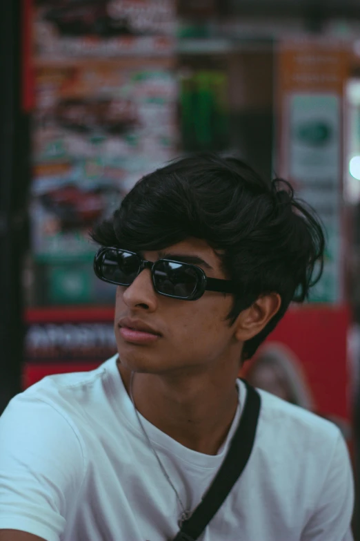 a young man wearing sunglasses and a white shirt, by Max Dauthendey, trending on pexels, sumatraism, black teenage boy, portait photo profile picture, at a mall, indian