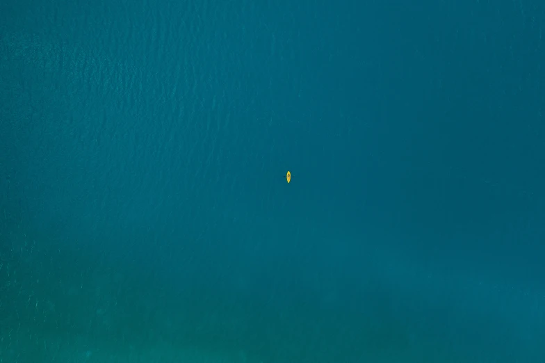 a large body of water with a boat in it, unsplash contest winner, minimalism, yellow and blue and cyan, shot from 5 0 feet distance, an astronaut lost in the ocean, shot on canon eos r 5