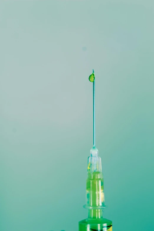 a syll with a needle sticking out of it, a microscopic photo, by Christoph Amberger, unsplash, conceptual art, 🍸🍋, 1km tall, one green, surgical iv drip