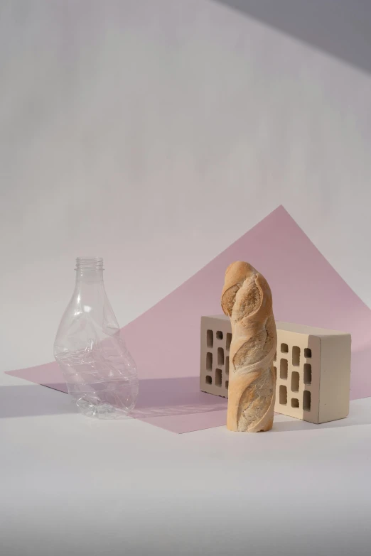 a couple of figurines sitting on top of a table, an abstract sculpture, inspired by Giorgio Morandi, klein bottle, pink marble building, clear photo, dough sculpture