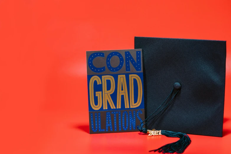 a graduation cap sitting on top of a book, by Julia Pishtar, dark blue + dark orange, foil, focus on card, come on