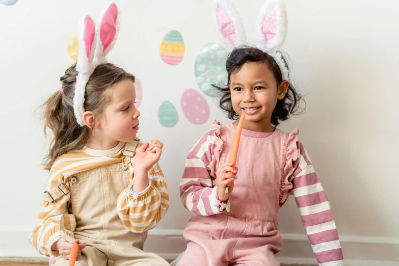 two little girls in bunny ears sitting on the floor, inspired by Elsa Beskow, pexels contest winner, graffiti, easter, young girl playing flute, varying ethnicities, casual game