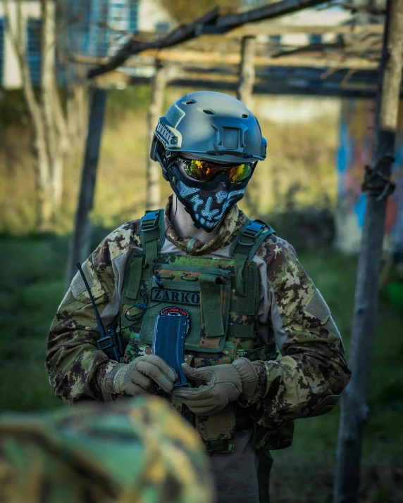 a man in camouflage is holding a camera, reddit, wearing an elaborate helmet, softair arena landscape, profile image, game ready