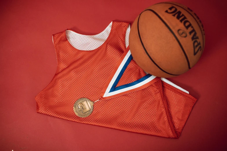 a basketball jersey and a basketball on a red surface, dribble contest winner, medallions, no - text no - logo, fancy dress, inauguration