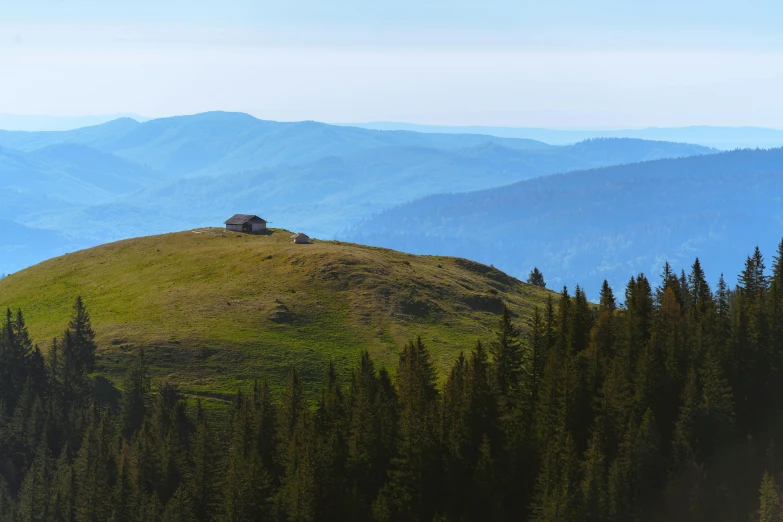 a small house sitting on top of a green hill, by Alexander Runciman, pexels contest winner, carpathian mountains, profile image, panorama distant view, hut