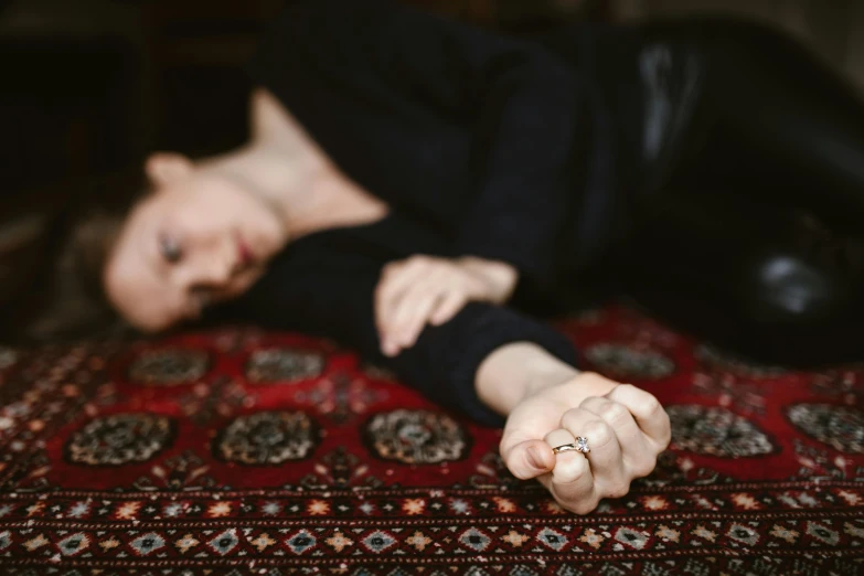 a woman laying on a bed with a ring on her finger, inspired by Elsa Bleda, unsplash, arabesque, red carpeted floor, concerned, 15081959 21121991 01012000 4k, displayed