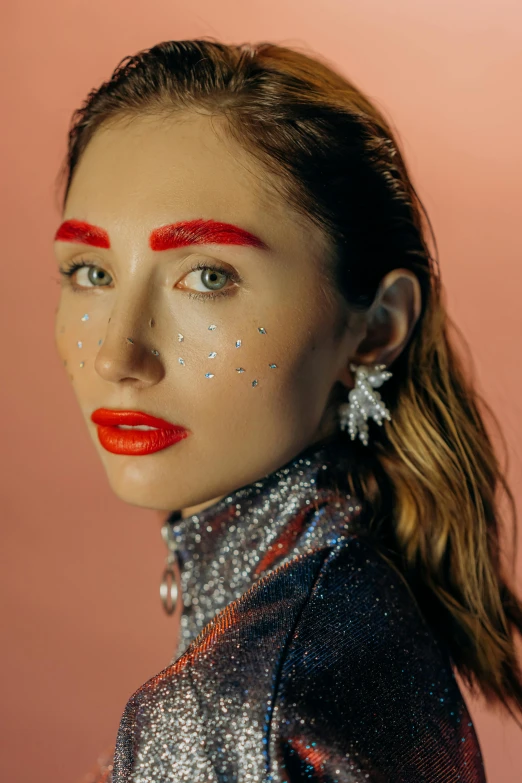 a woman with red lipstick and glitter on her face, an album cover, by Julia Pishtar, trending on pexels, gemma chan girl portrait, raised eyebrows, elizabeth olsen, iridescent accents. vibrant