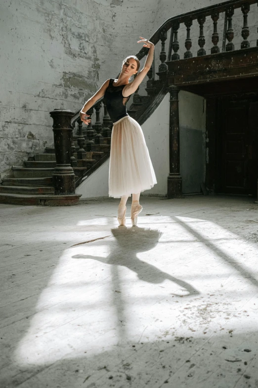 a woman that is standing in the middle of a room, by Elizabeth Polunin, unsplash contest winner, arabesque, instagram story, action pose : : spotlight, silver，ivory, beautiful daylight