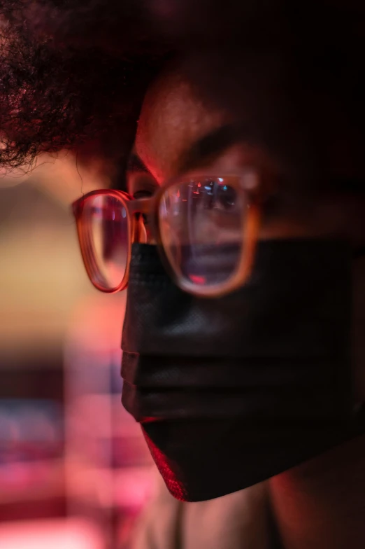 a close up of a person wearing a face mask, inspired by Gordon Parks, glasses |, red glow, multiple stories, ashteroth