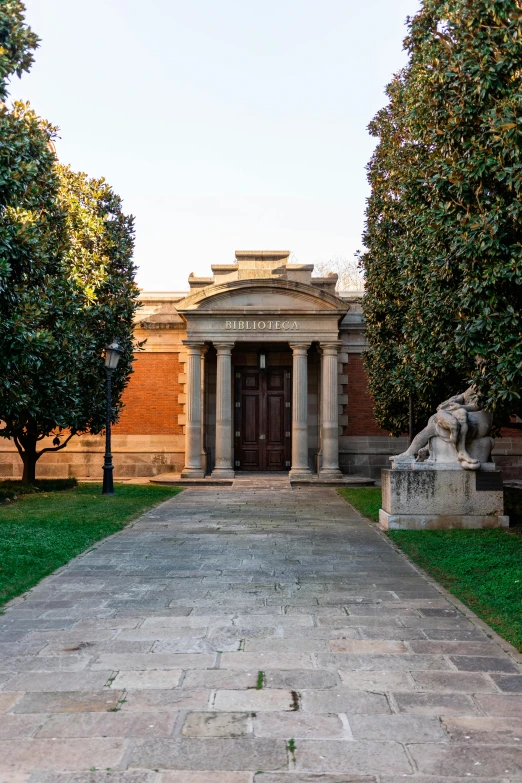 a stone walkway in front of a brick building, inspired by Giovanni Battista Innocenzo Colombo, neoclassicism, mausoleum, at the golden hour, sorolla, from the distance