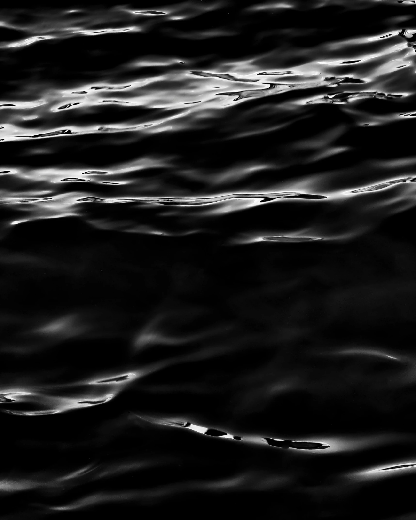 a black and white photo of a body of water, inspired by Edward Weston, unsplash, minimalism, dark plastic, glowing water, high contrast hyperrealism 8k, peter hurley