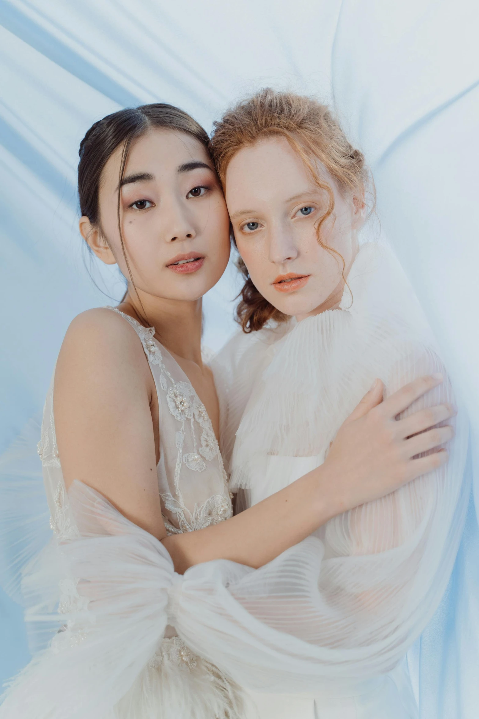 a couple of women standing next to each other, by Tan Ting-pho, unsplash, renaissance, beautiful pale makeup, wearing organza gown, white and pale blue, zeen chin and terada katsuya