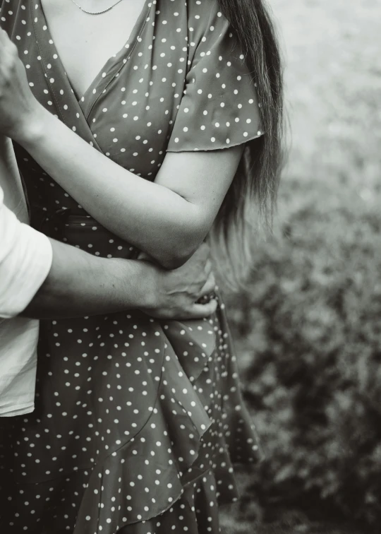 a black and white photo of a man and a woman, a black and white photo, pexels contest winner, man grabbing a womans waist, polka dot, boy girl traditional romance, 15081959 21121991 01012000 4k