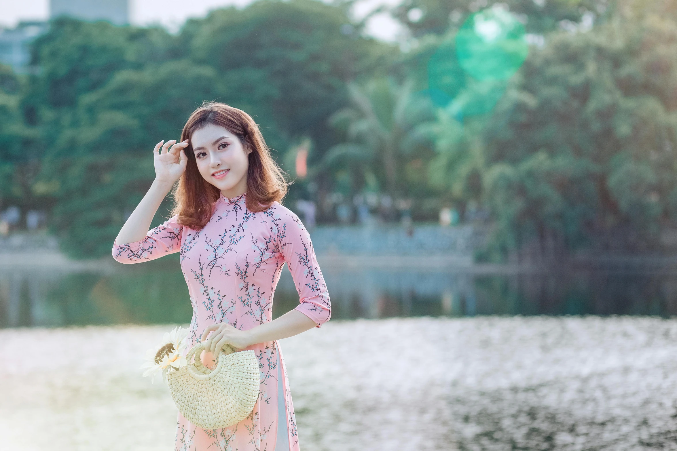 a woman in a pink dress standing next to a body of water, inspired by Tan Ting-pho, pexels contest winner, happening, young cute wan asian face, ao dai, youtube thumbnail, girls