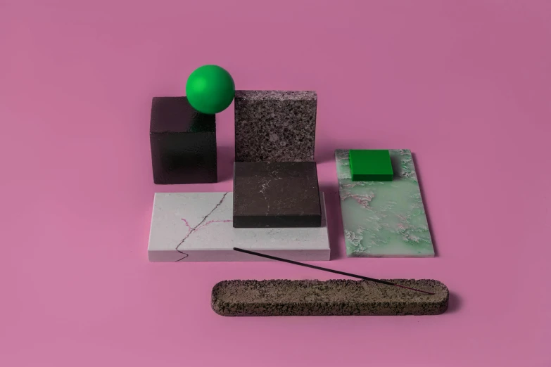 a green object sitting on top of a pink surface, an abstract sculpture, modular constructivism, smoke and rubble, detailed product image, slate, incense