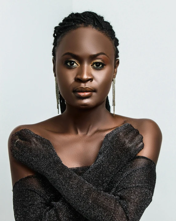 a beautiful young woman posing for a picture, an album cover, inspired by Chinwe Chukwuogo-Roy, trending on pexels, queer woman, translucent skin, hands retouched, lupita nyong'o