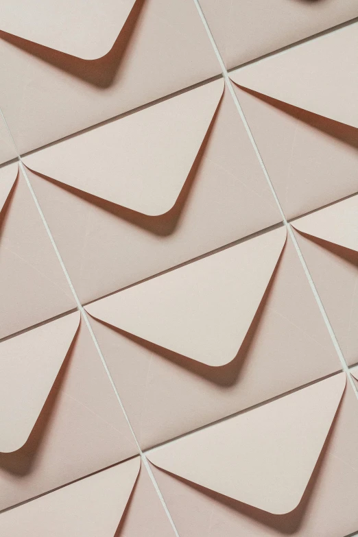 a close up of a pattern on a wall, inspired by Peter de Sève, trending on unsplash, smokey burnt envelopes, light pink, thumbnail, paper airplane