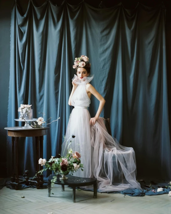 a woman in a wedding dress posing for a picture, a portrait, inspired by Cecil Beaton, portrait featured on unsplash, still life photo studio, dasha taran, lomography lady grey