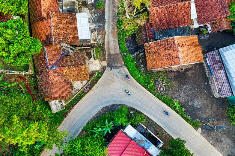 an aerial view of a small town surrounded by trees, by Dan Content, pexels contest winner, vietnam, square, background image, well worn