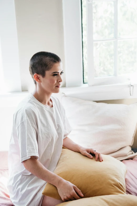 a man and a woman sitting on a bed, happening, brown buzzcut, jen atkin, photo of young woman, recovering from pain