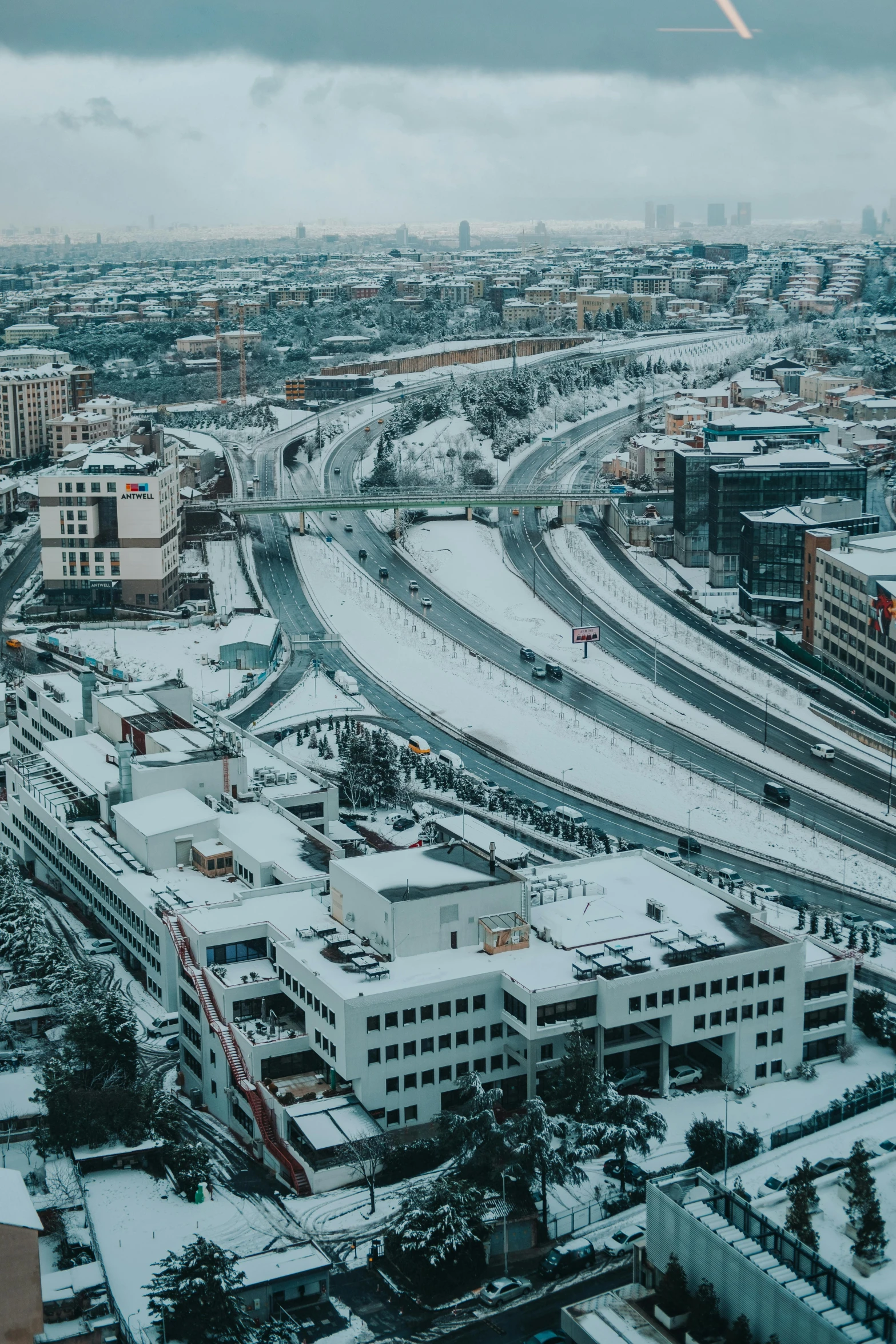 an aerial view of a city covered in snow, swedish urban landscape, unsplash photography, square, infrastructure